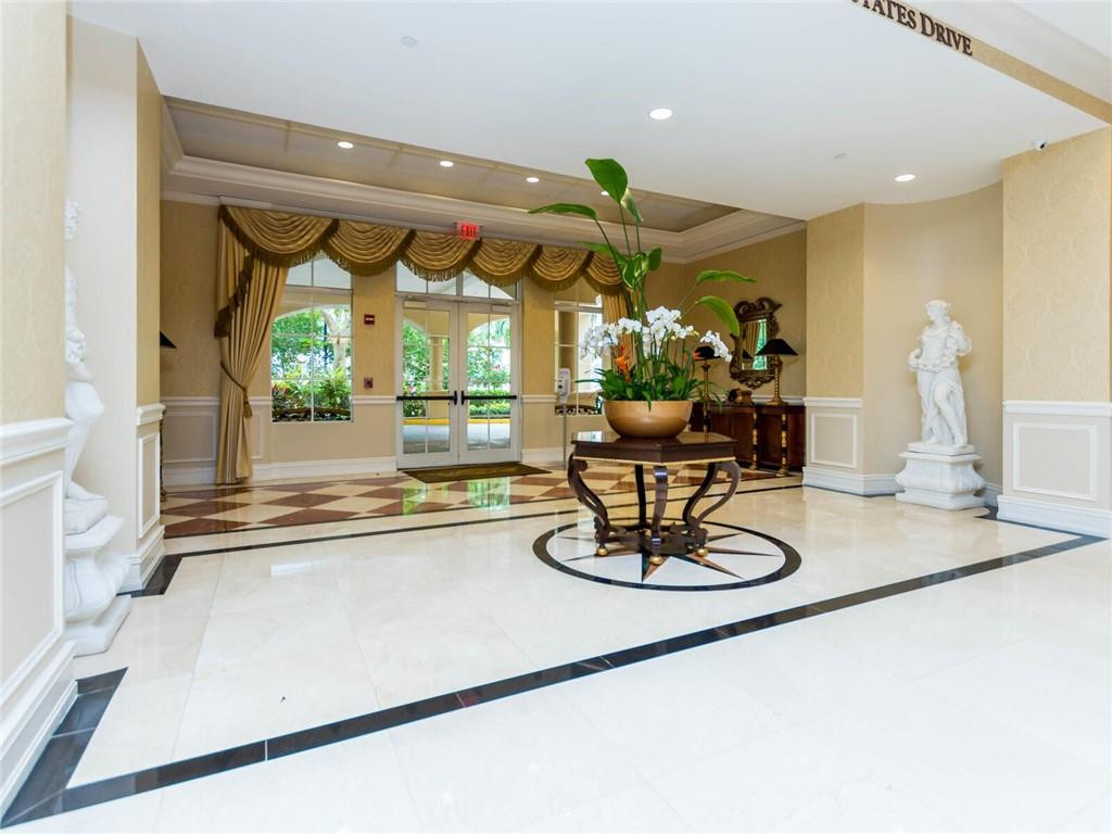 16101 Emerald Estates Drive, Unit 252 Weston, FL 33331 - Photo 40 of 51 a kitchen with a large counter top appliances and cabinets