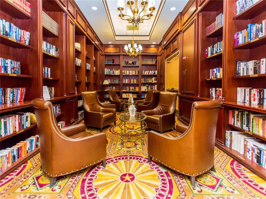 16101 Emerald Estates Drive, Unit 252 Weston, FL 33331 - Photo 41 of 51 a view of a living room with furniture and book shelf