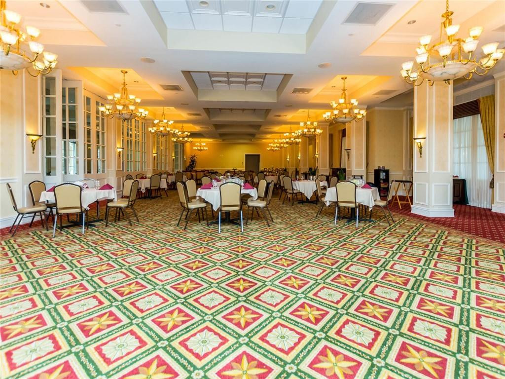 16101 Emerald Estates Drive, Unit 252 Weston, FL 33331 - Photo 44 of 51 a group of people sitting on terrace