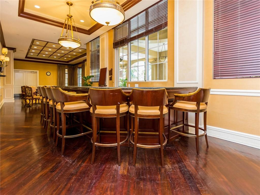 16101 Emerald Estates Drive, Unit 252 Weston, FL 33331 - Photo 46 of 51 a view of a dining room with furniture window and wooden floor