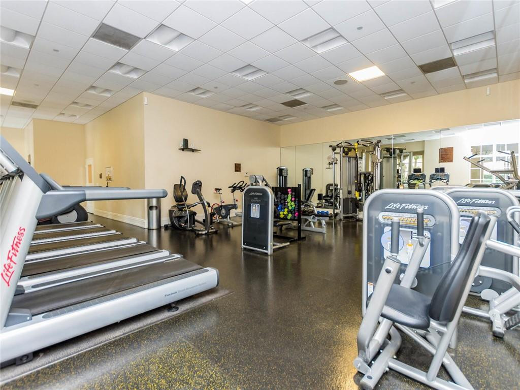 16101 Emerald Estates Drive, Unit 252 Weston, FL 33331 - Photo 48 of 51 a gym room with lots of gym equipment