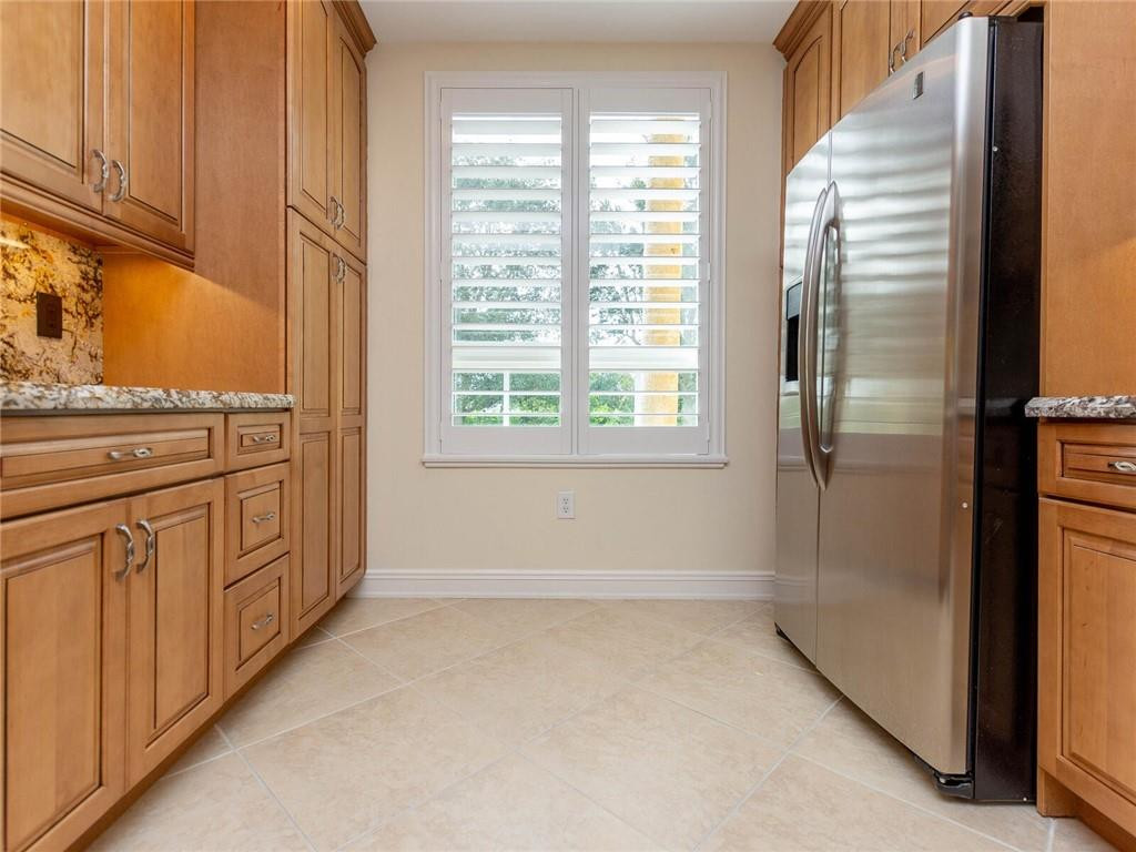 16101 Emerald Estates Drive, Unit 252 Weston, FL 33331 - Photo 6 of 51 a view of a kitchen with cabinets and a window