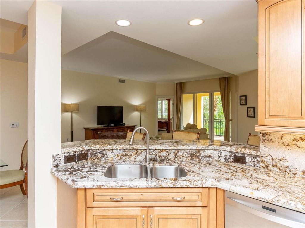16101 Emerald Estates Drive, Unit 252 Weston, FL 33331 - Photo 10 of 51 a bathroom with a granite countertop sink and a mirror