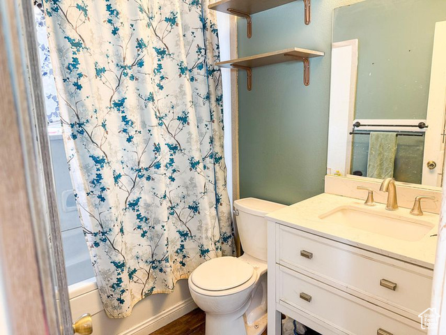 425 East Mule Deer Road Central, UT 84722 - Photo 26 of 72 Full bath featuring toilet, vanity, shower / bath combination with curtain, and wood finished floors