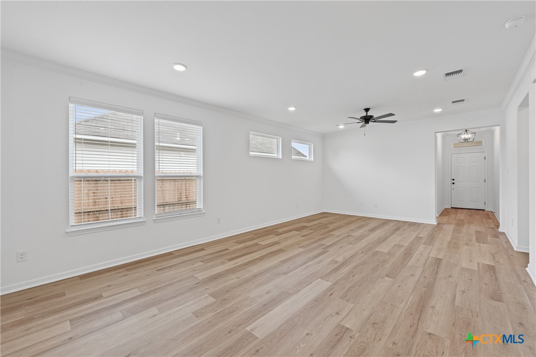 8019 Pineridge Way Temple, TX 76502 - Photo 12 of 32 an empty room with wooden floor and windows