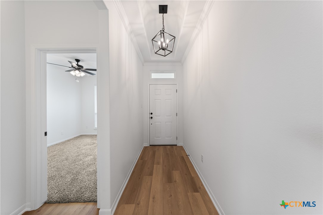 8019 Pineridge Way Temple, TX 76502 - Photo 6 of 32 a view of a hallway with wooden floor and closet