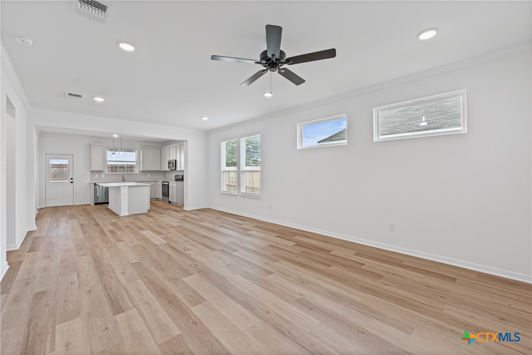 8019 Pineridge Way Temple, TX 76502 - Photo 9 of 32 a view of empty room with wooden floor and window