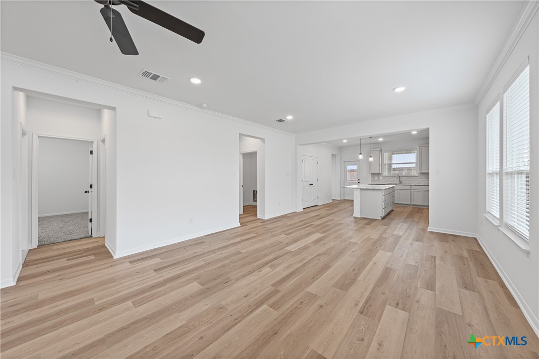 8019 Pineridge Way Temple, TX 76502 - Photo 10 of 32 a view of empty room with wooden floor and windows