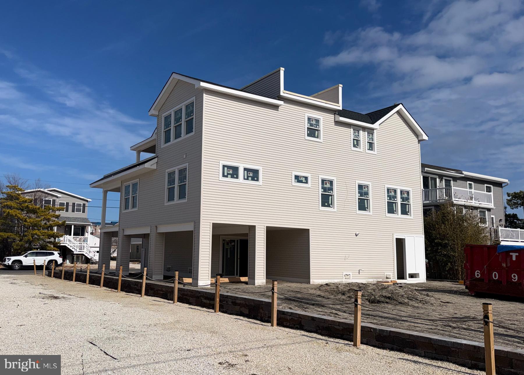 354 West 11th Street Ship Bottom, NJ 08008 - Photo 15 of 38 a front view of a building with parking space