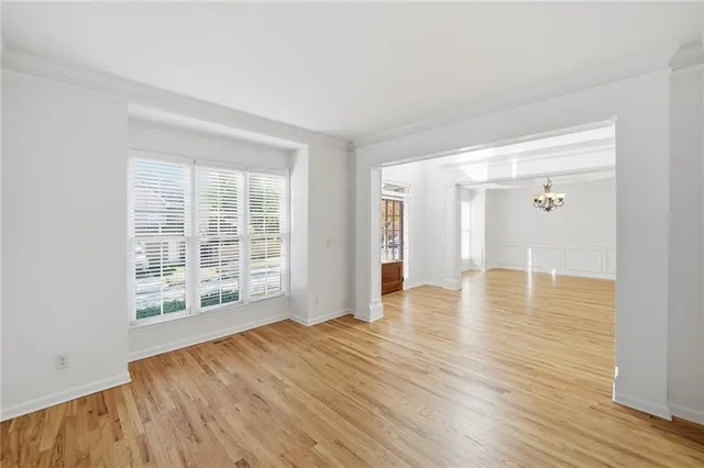 a white toilet sitting next to a white sink