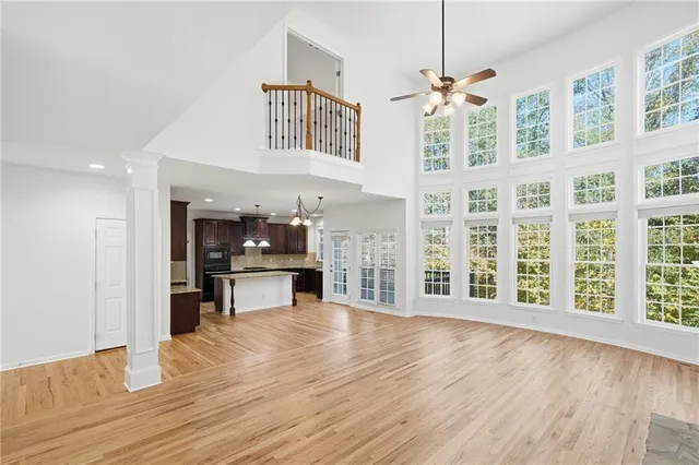 a view of an entryway with kitchen and windows