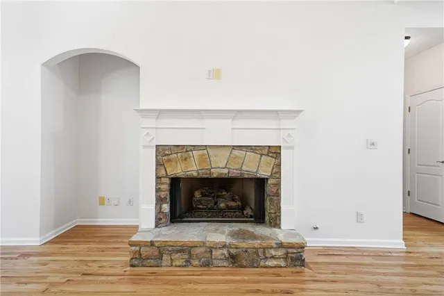 a kitchen with kitchen island granite countertop a sink cabinets and stainless steel appliances