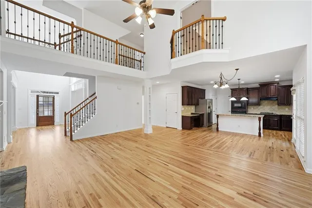 a kitchen with stainless steel appliances granite countertop wooden cabinets a stove a sink and dishwasher