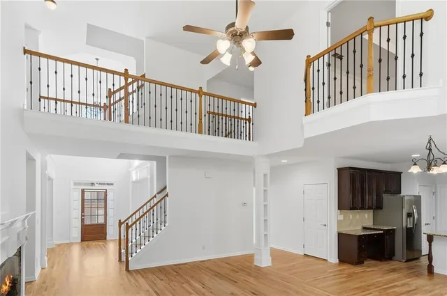 a kitchen with granite countertop wooden cabinets stainless steel appliances and a counter space