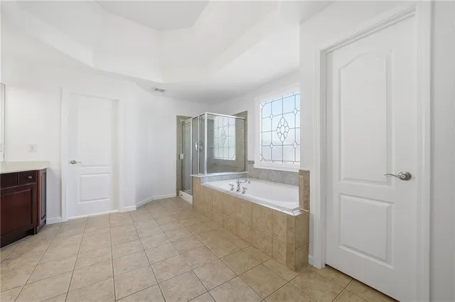 a view of a livingroom with wooden floor and a window