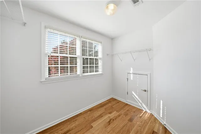 a view of a house with a wooden deck