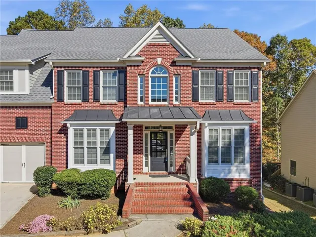 a front view of a house with balcony