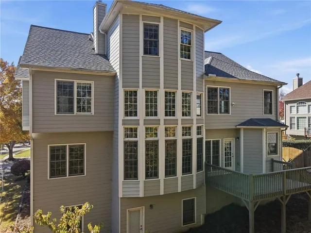 an aerial view of a house with outdoor space
