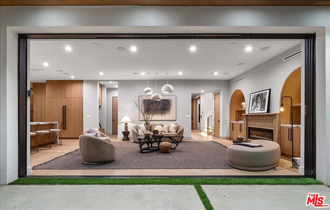 11317 Valley Spring Lane Studio City, CA 91602 - Photo 11 of 40 a living room with furniture and a rug