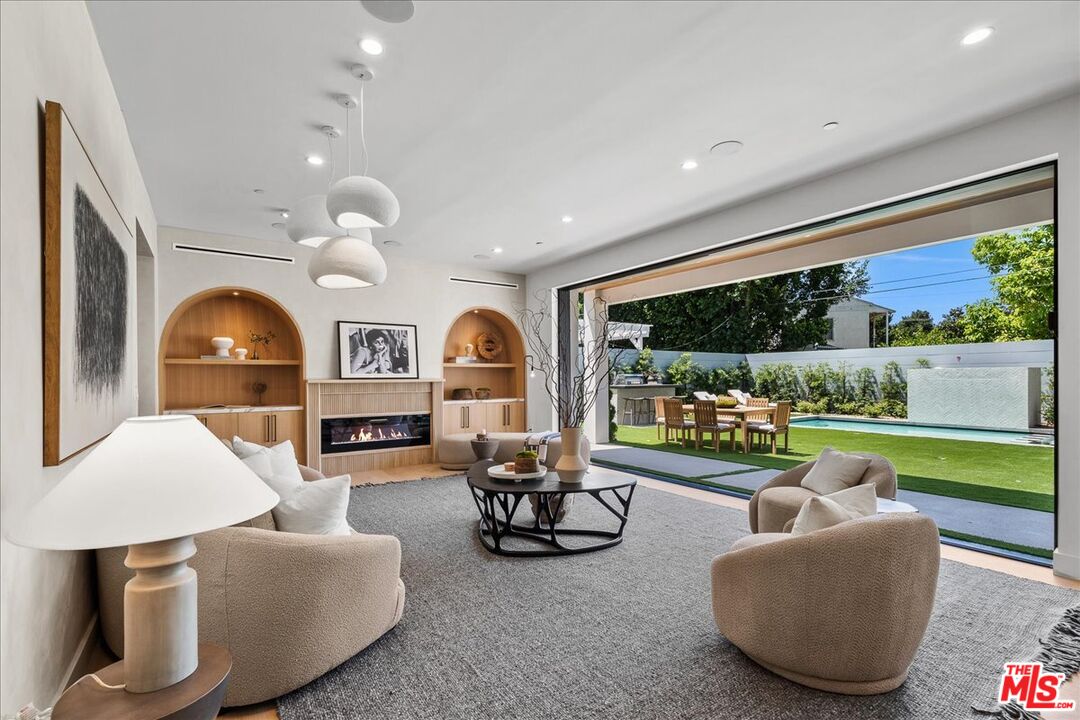 11317 Valley Spring Lane Studio City, CA 91602 - Photo 13 of 40 a living room with furniture and a large window