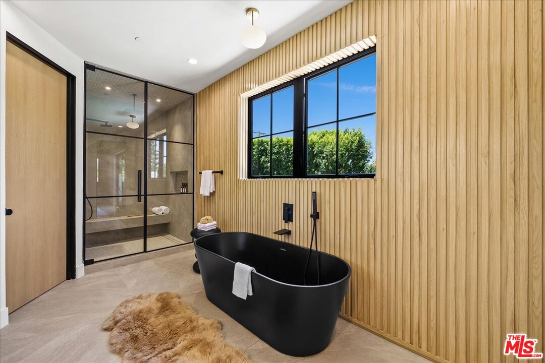 11317 Valley Spring Lane Studio City, CA 91602 - Photo 22 of 40 a kitchen with a sink and a refrigerator
