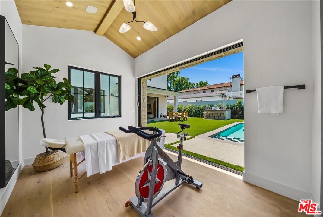 11317 Valley Spring Lane Studio City, CA 91602 - Photo 32 of 40 a view of a room with gym equipment