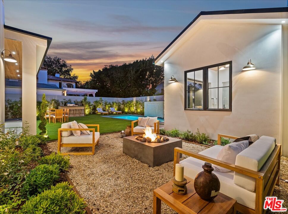 11317 Valley Spring Lane Studio City, CA 91602 - Photo 33 of 40 a bedroom with furniture and a window