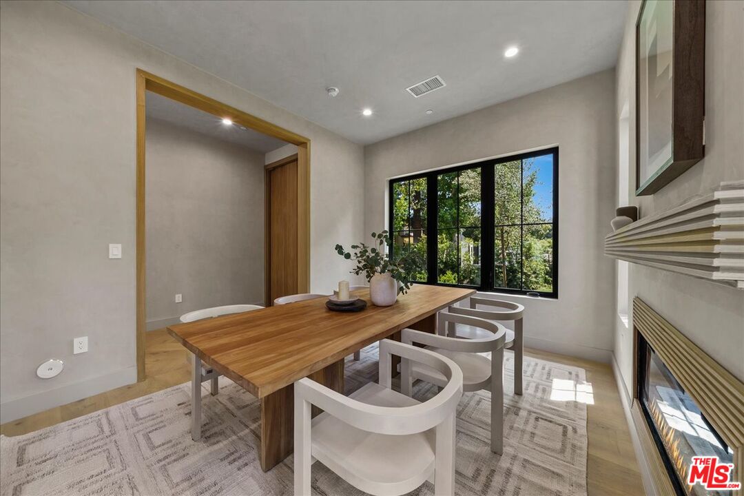 11317 Valley Spring Lane Studio City, CA 91602 - Photo 9 of 40 a view of a dining room with furniture window and outside view