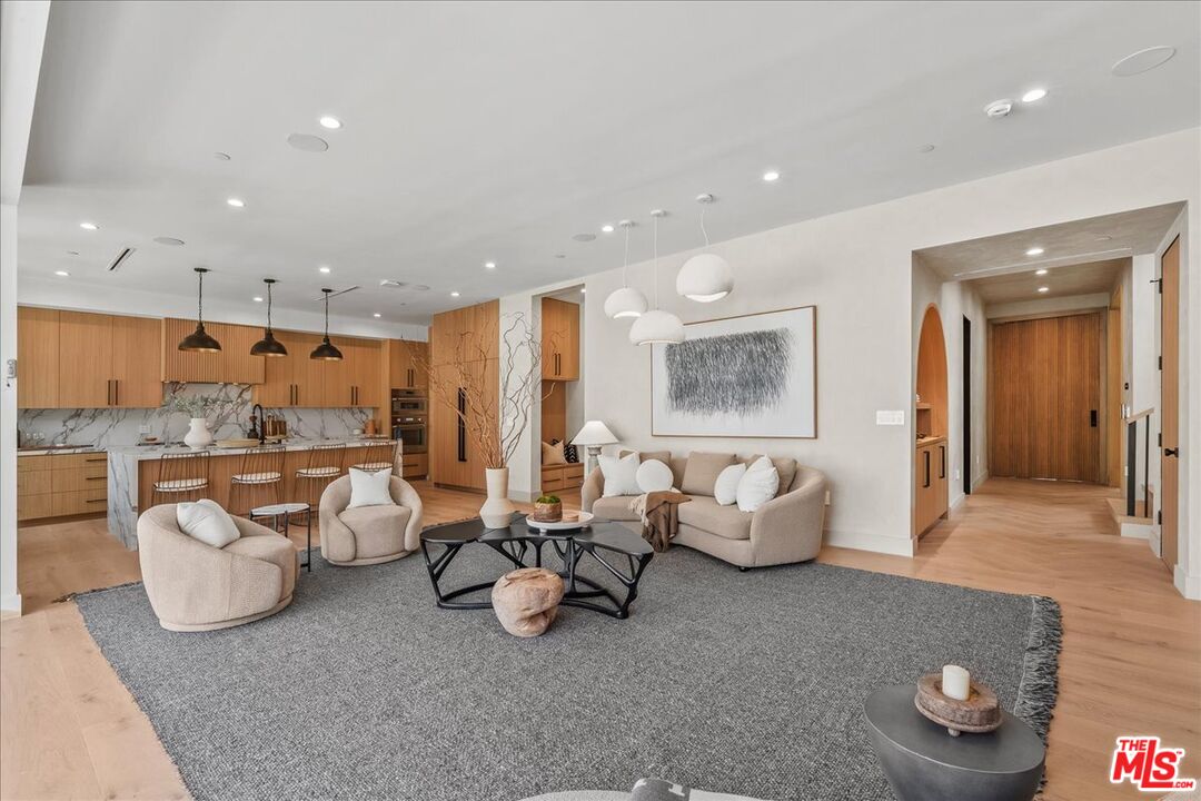 11317 Valley Spring Lane Studio City, CA 91602 - Photo 10 of 40 a living room with furniture and a large window