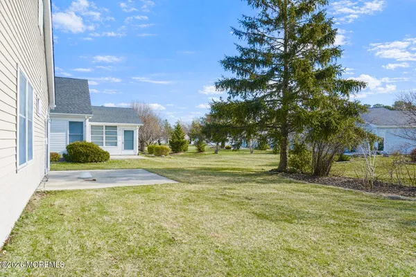 a view of house with yard