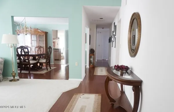 a bedroom with furniture and a wooden floor