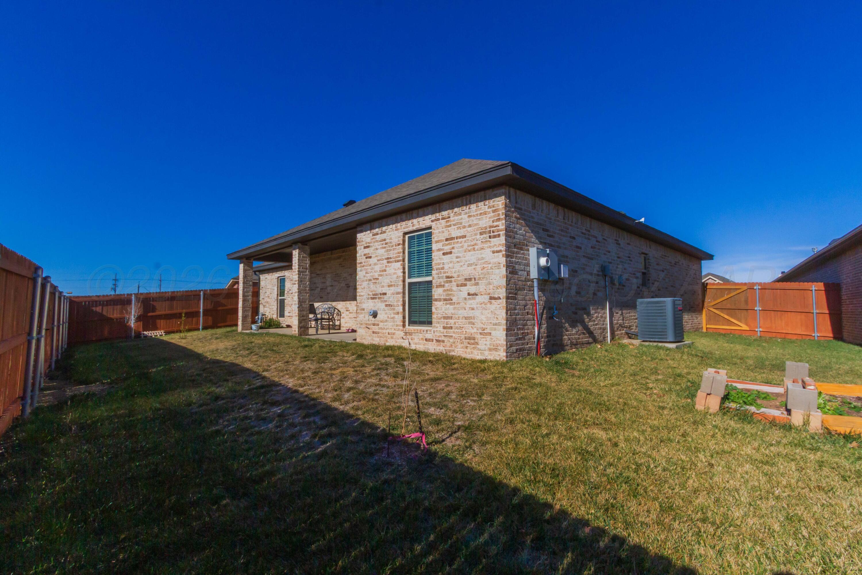 6909 Tatum Circle Amarillo, TX 79119 - Photo 32 of 33 a view of a house with backyard