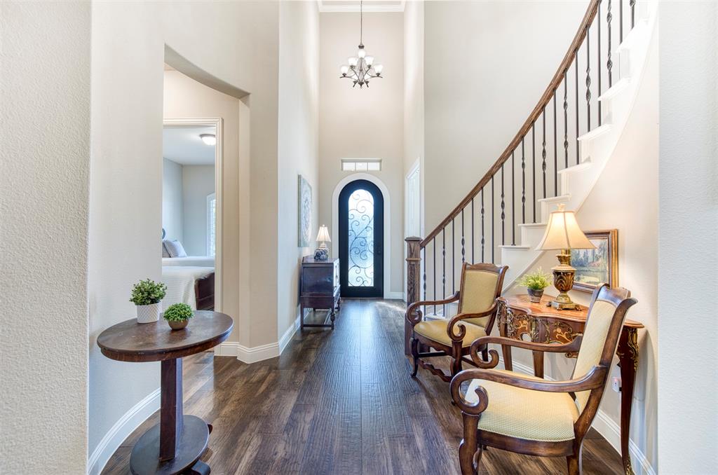 7760 Hackamore Street Frisco, TX 75036 - Photo 3 of 40 Impressive entry with chandelier & wood flooring.