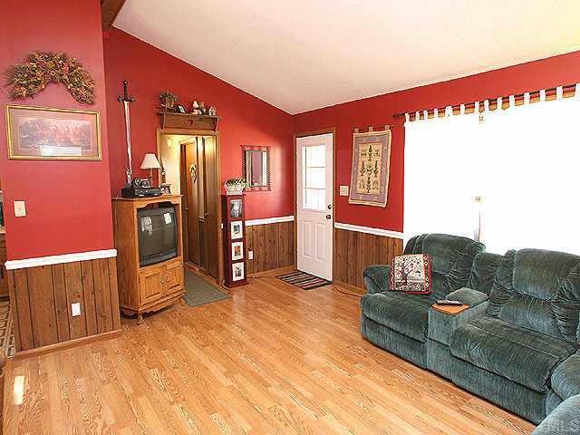 11309 John Allen Road Raleigh, NC 27614 - Photo 1 of 9 a living room with furniture and a flat screen tv