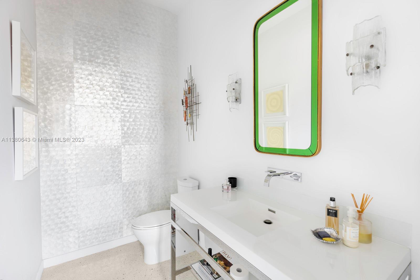 380 Woodcrest Road Key Biscayne, FL 33149 - Photo 16 of 31 a bathroom with a sink and a mirror