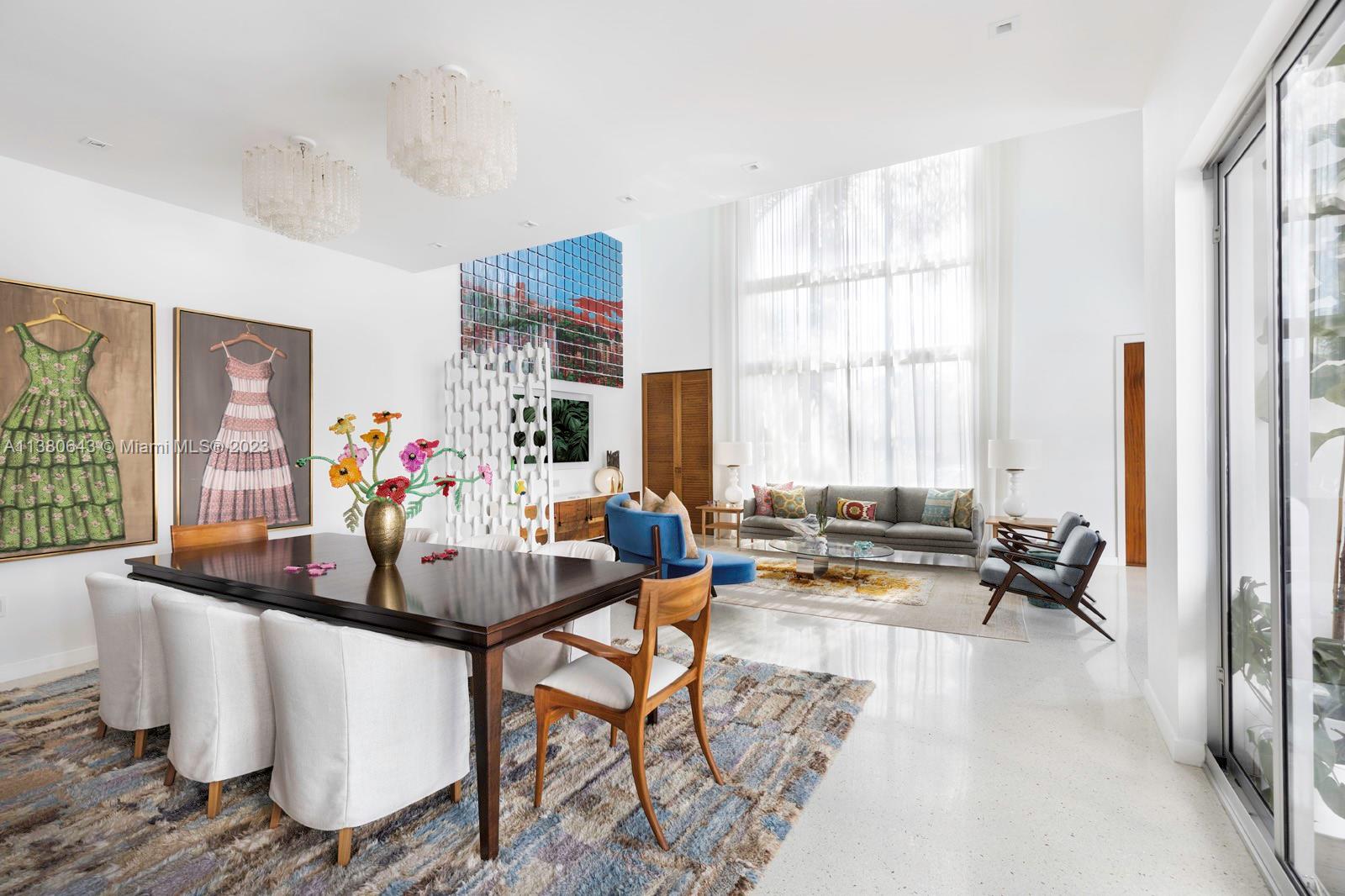 380 Woodcrest Road Key Biscayne, FL 33149 - Photo 6 of 31 a dining room with furniture and a large window