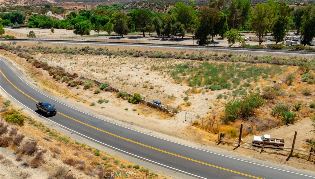 0 Crown Valley Rd Vista Acton, CA 93510 - Photo 1 of 19 a view of swimming pool with a yard and plants