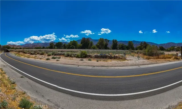 a view of a living room with a fireplace