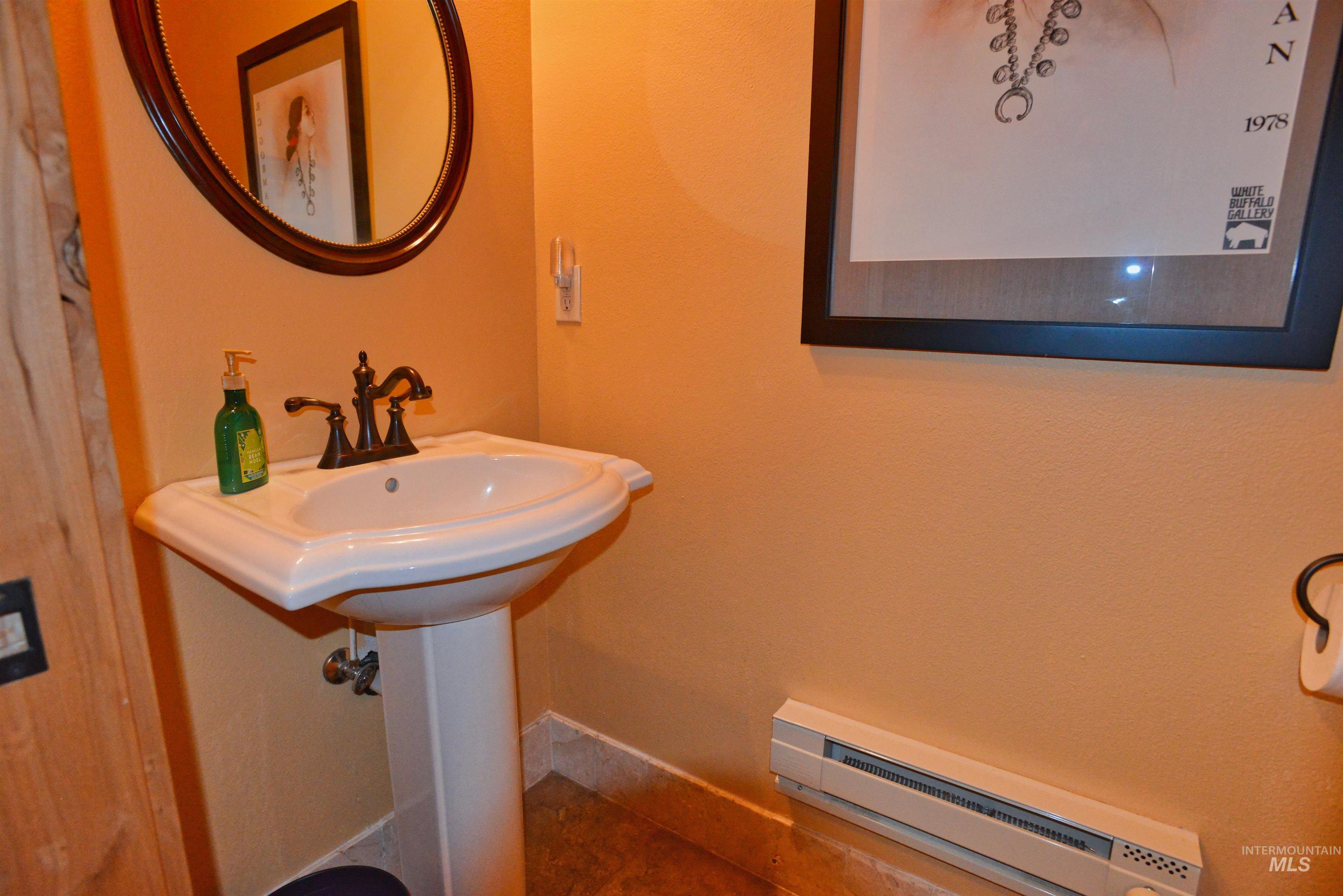 788 Chad Loop McCall, ID 83638 - Photo 8 of 22 Pedestal sink with bronze-finish faucet