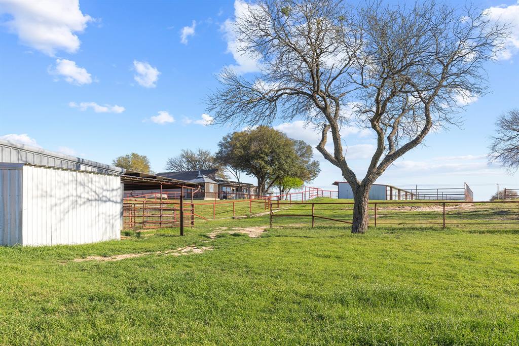 304 Scarlett Road Weatherford, TX 76087 - Photo 11 of 32 a view of yard with swimming pool and green space