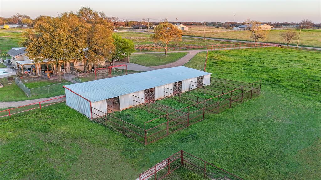 304 Scarlett Road Weatherford, TX 76087 - Photo 3 of 32 a aerial view of a house with a garden and lake view