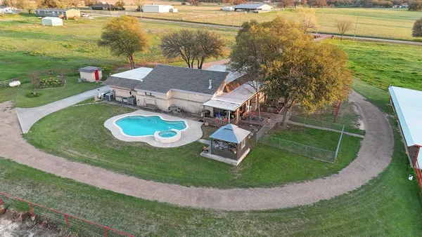 an aerial view of a house having yard