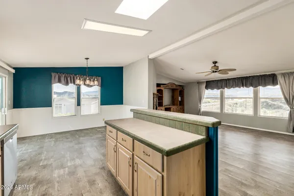 a kitchen with a stove sink and refrigerator