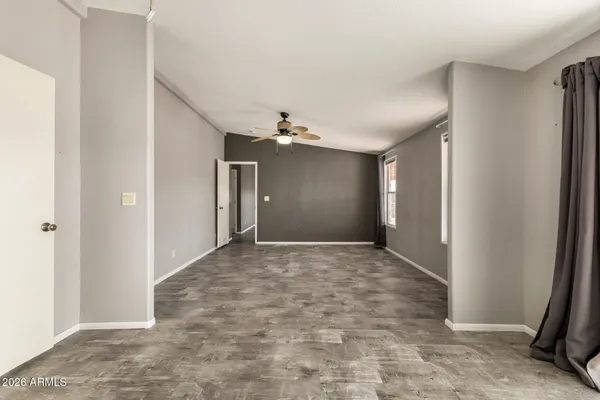 a view of an empty room with a window