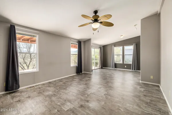 a view of a big room with closet and chandelier fan