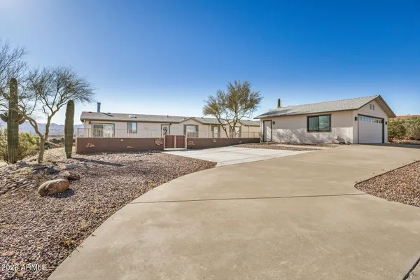 a house with palm tree in front of it