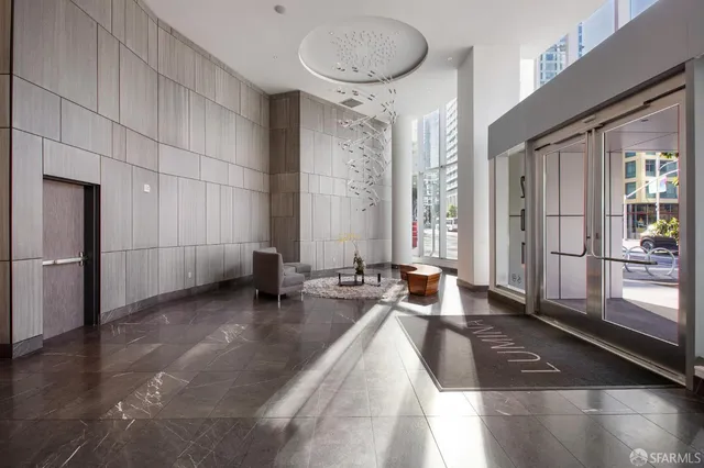 a large white kitchen with a large window
