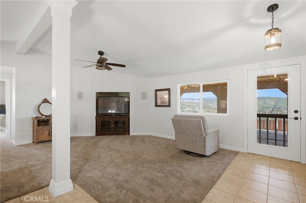 40100 Owl Valley Road Temecula, CA 92592 - Photo 28 of 44 a living room with furniture and a ceiling fan