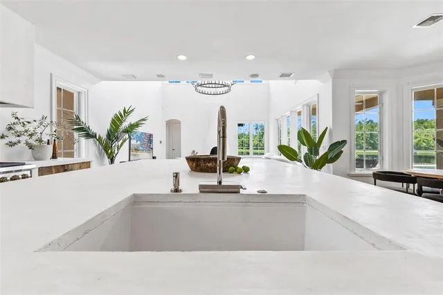 a bathroom with sink and a large mirror