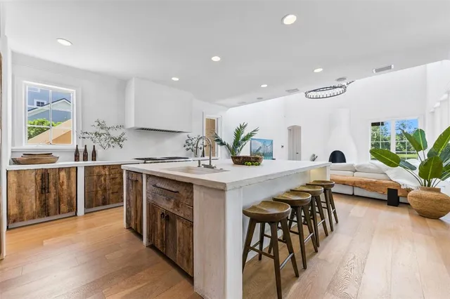 a kitchen with counter top space and appliances